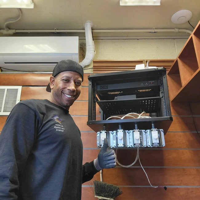 worker doing some cabling on a house system